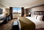 Photo of the Holiday Inn and Suites Phoenix Airport North standard suites bedroom.